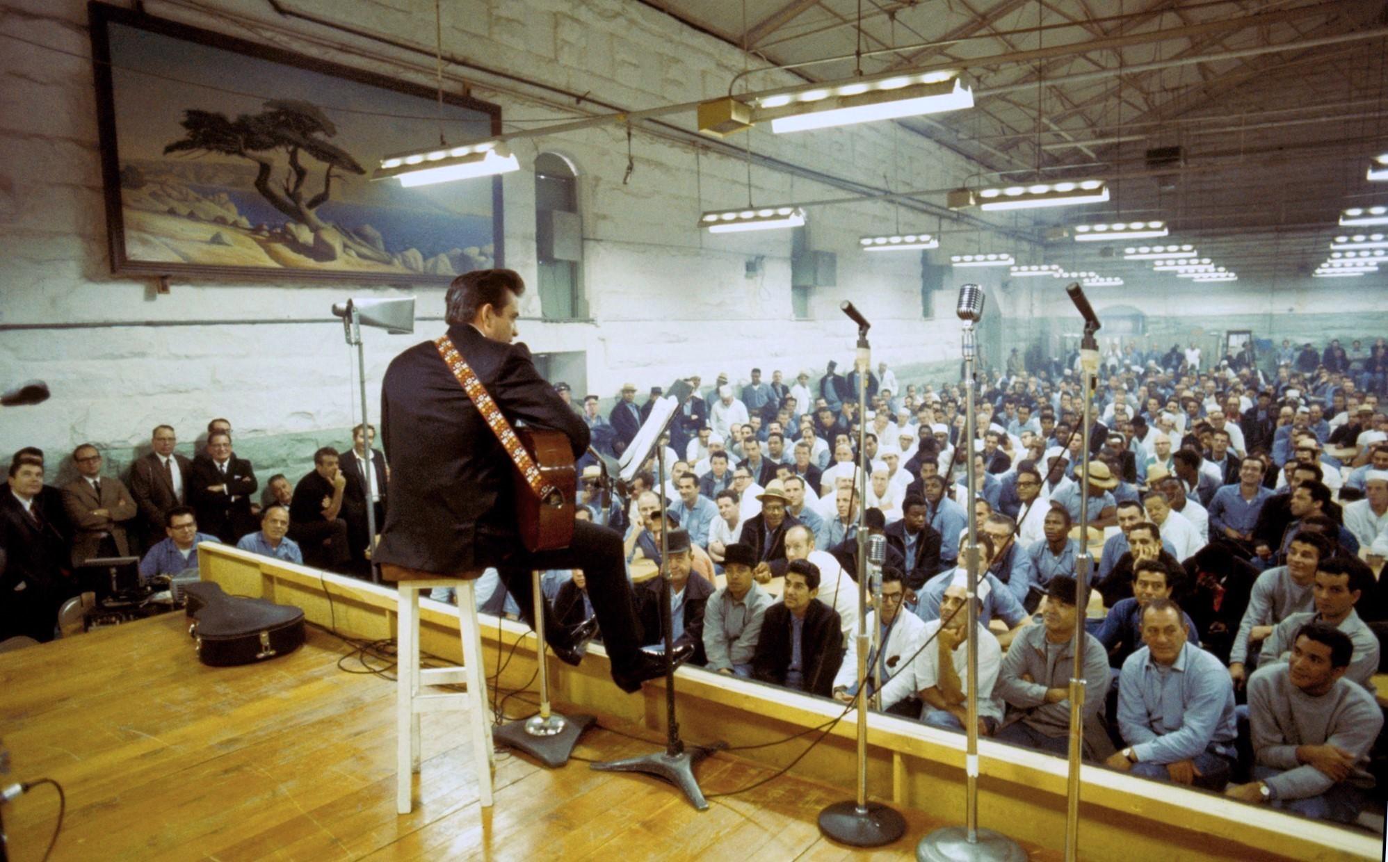 Johnny Cash performs for a packed crowd of inmates at Folsom Prison in 1968.